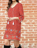 Red V Neck Bohemian styled dress with Floral print, v neck, above the knee, and tassels
